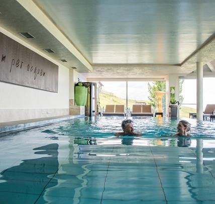 Two guests swim in the pool