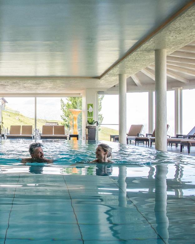 Two guests swim in the pool